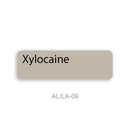 A label displaying a taupe-beige color labeled 'Xylocaine' with the code 'AL/LA-09' underneath on a white background.