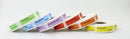 Six rolls of white adhesive syringe labels with colorful headers (green, blue, purple, orange, yellow) printed with drug names such as Atropine, Morphine, Metamizole, and Propofol, arranged on a white background.