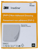 Front of a 3M Inadine non-adherent dressing box, showing the product name, size 5 cm x 5 cm, and a graphic of the square mesh dressing with one corner peeled back.