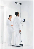 Patient Using Measuring Station in Doctors Office